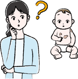 カフェ・オ・レ斑の出ている赤ちゃんと首をかしげている母親