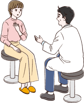 診察室で男性医師の診察を受けている20代女性患者さん