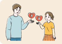 青年男性と小学生の女の子が向き合って医療費助成について話をしている様子